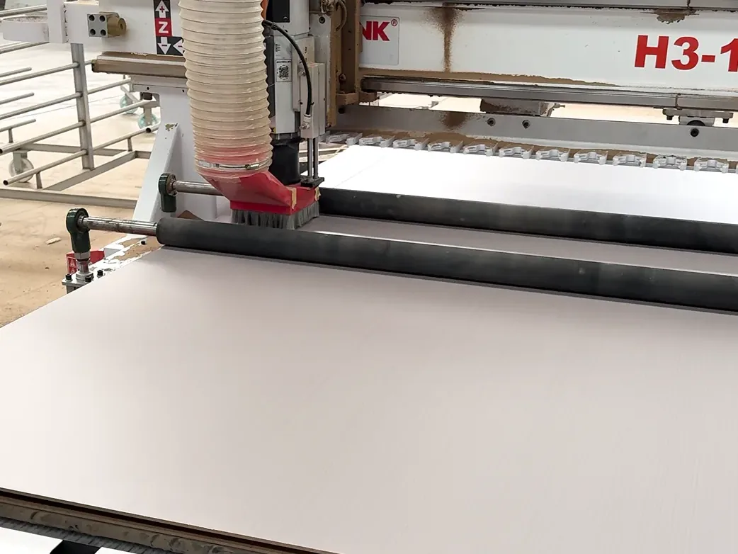 CNC equipment routing the surface of a door panel